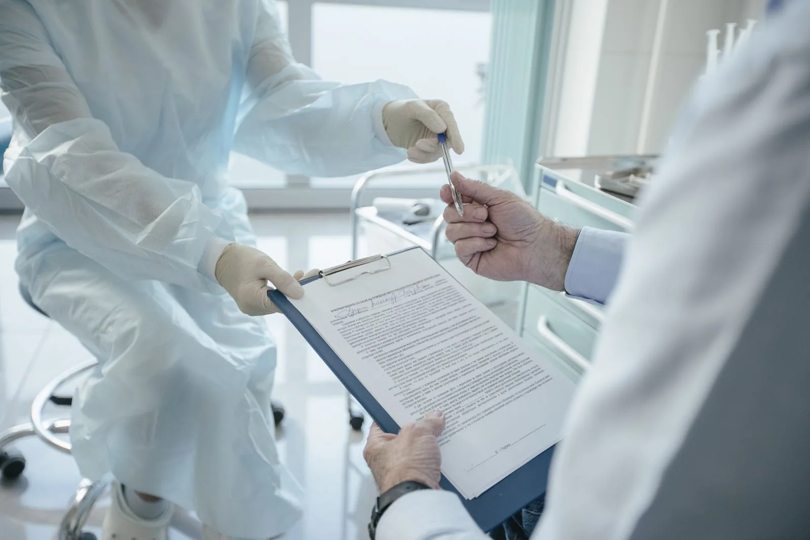 A clinician reviewing a document with a patient